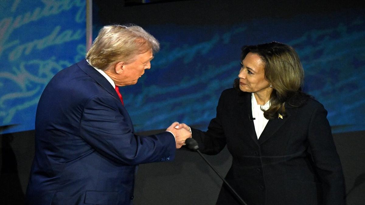 Presidential candidates Donald Trump and Kamala Harris shake hands